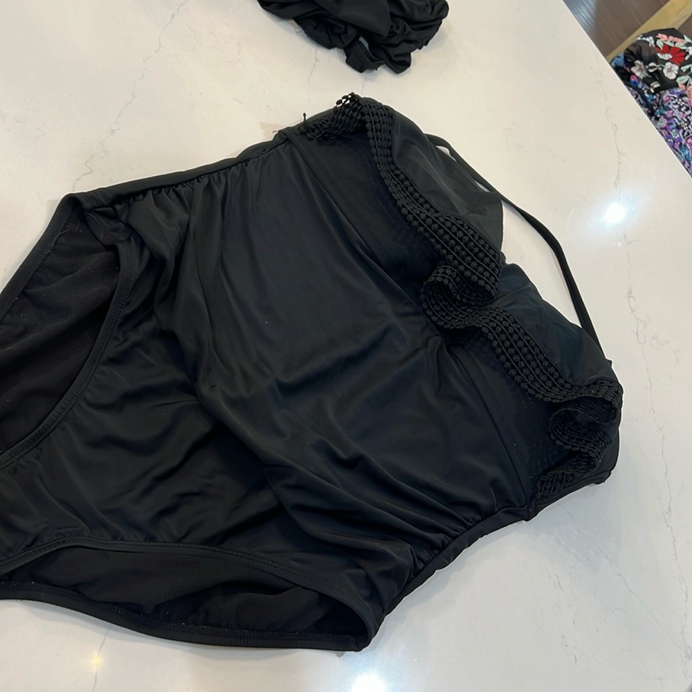 Black one piece with top ruffle.  Smoke free seller